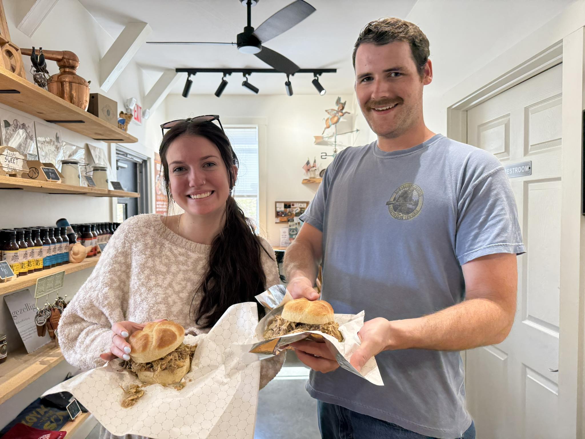 Guests enjoying pulled pork sandwiches at Gig's BBQ