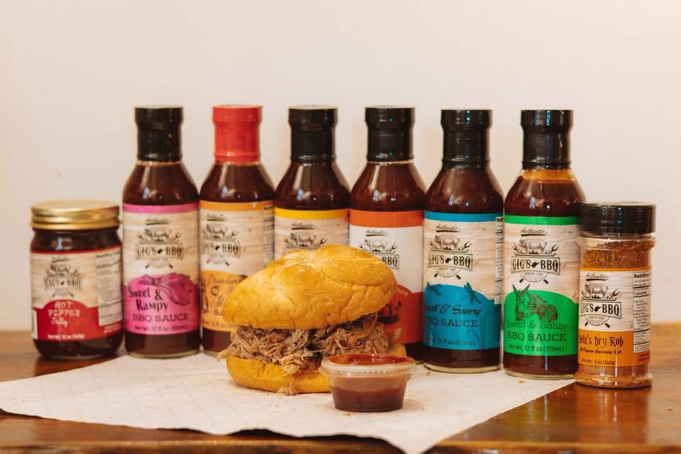 Gig's BBQ sauces, hot pepper jelly, Bella's dry rub, and a pulled pork sandwich